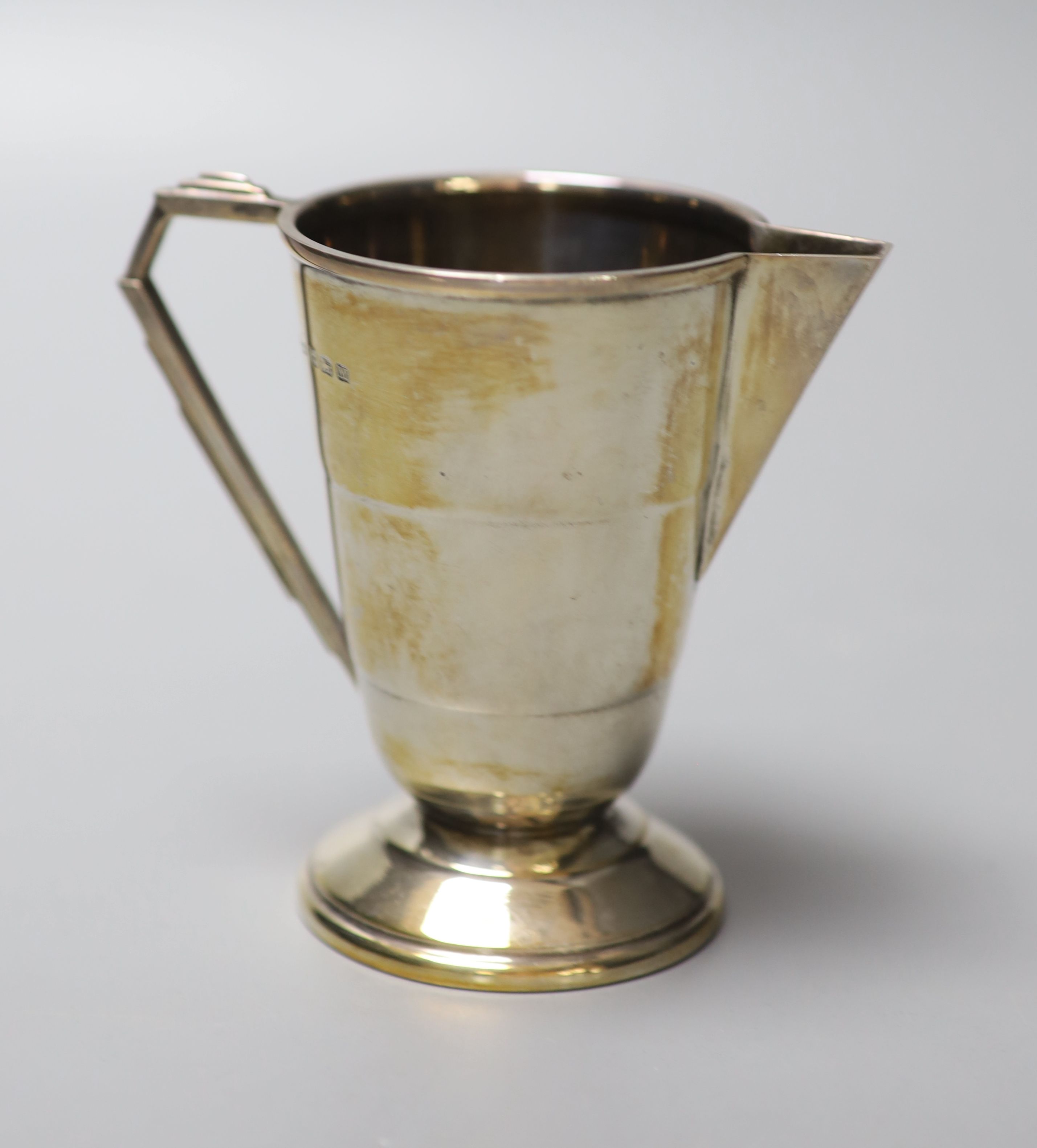 A George V Art Deco silver cream jug, Joseph Gloster Ltd, Birmingham, 1936, 10cm, 129 grams.